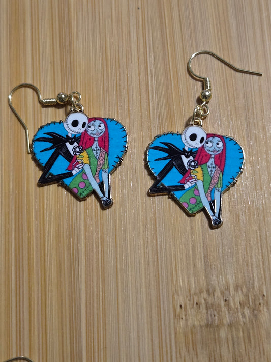 A pair of earrings featuring an animated character design, with blue hearts and multicolor elements jack and sally