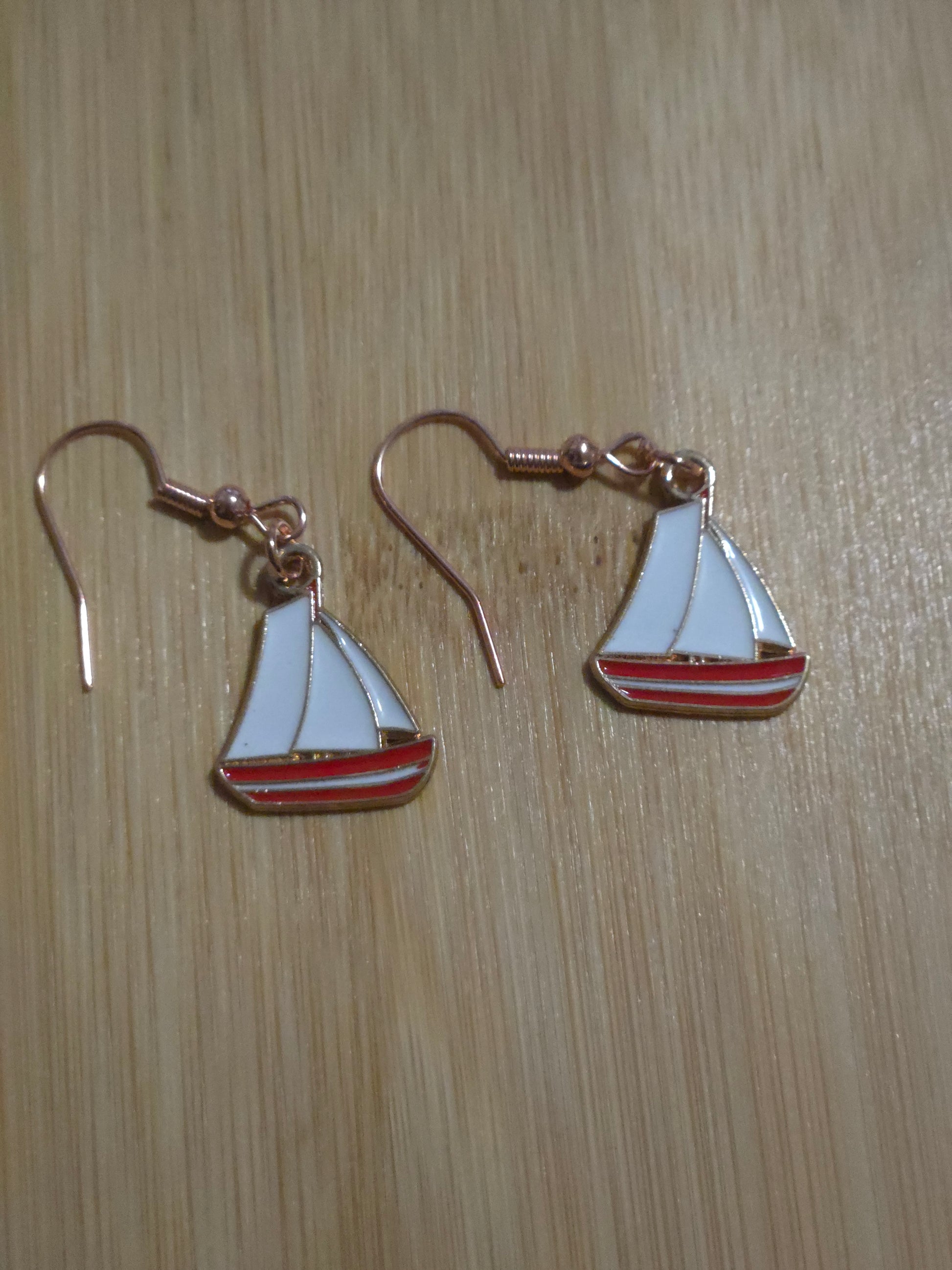 Red sailboat dangle earrings