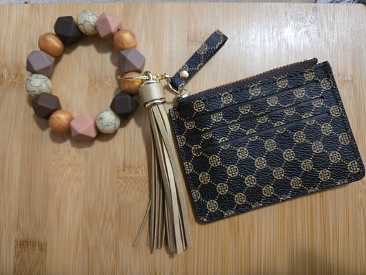 Bracelet with tassel and pouch on a wooden surface