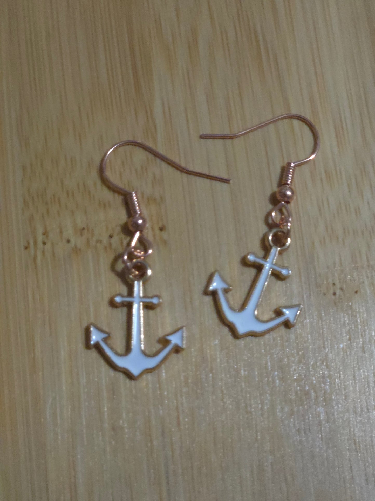 White dangle anchor earrings
