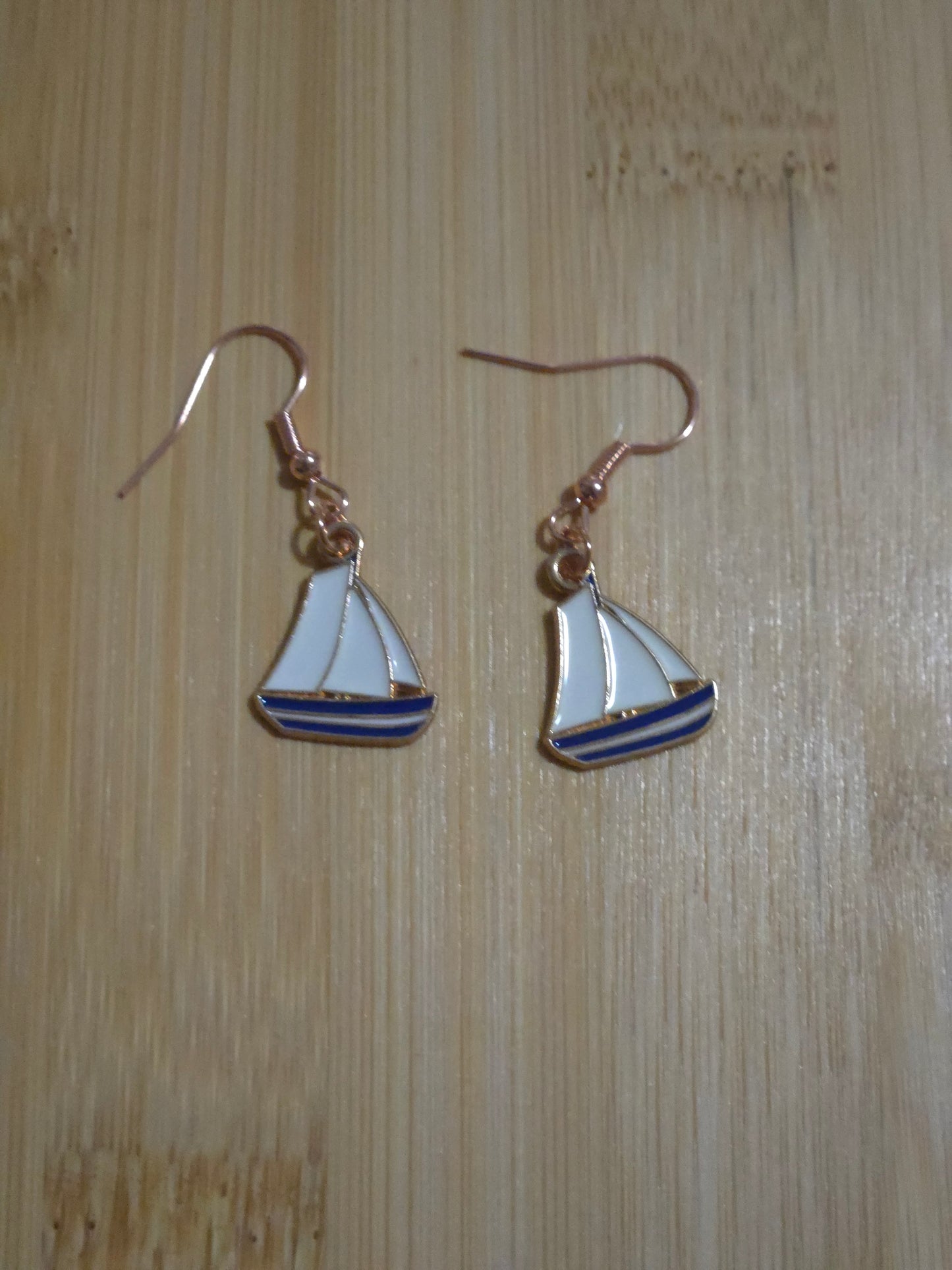 Blue sailboat dangle earrings