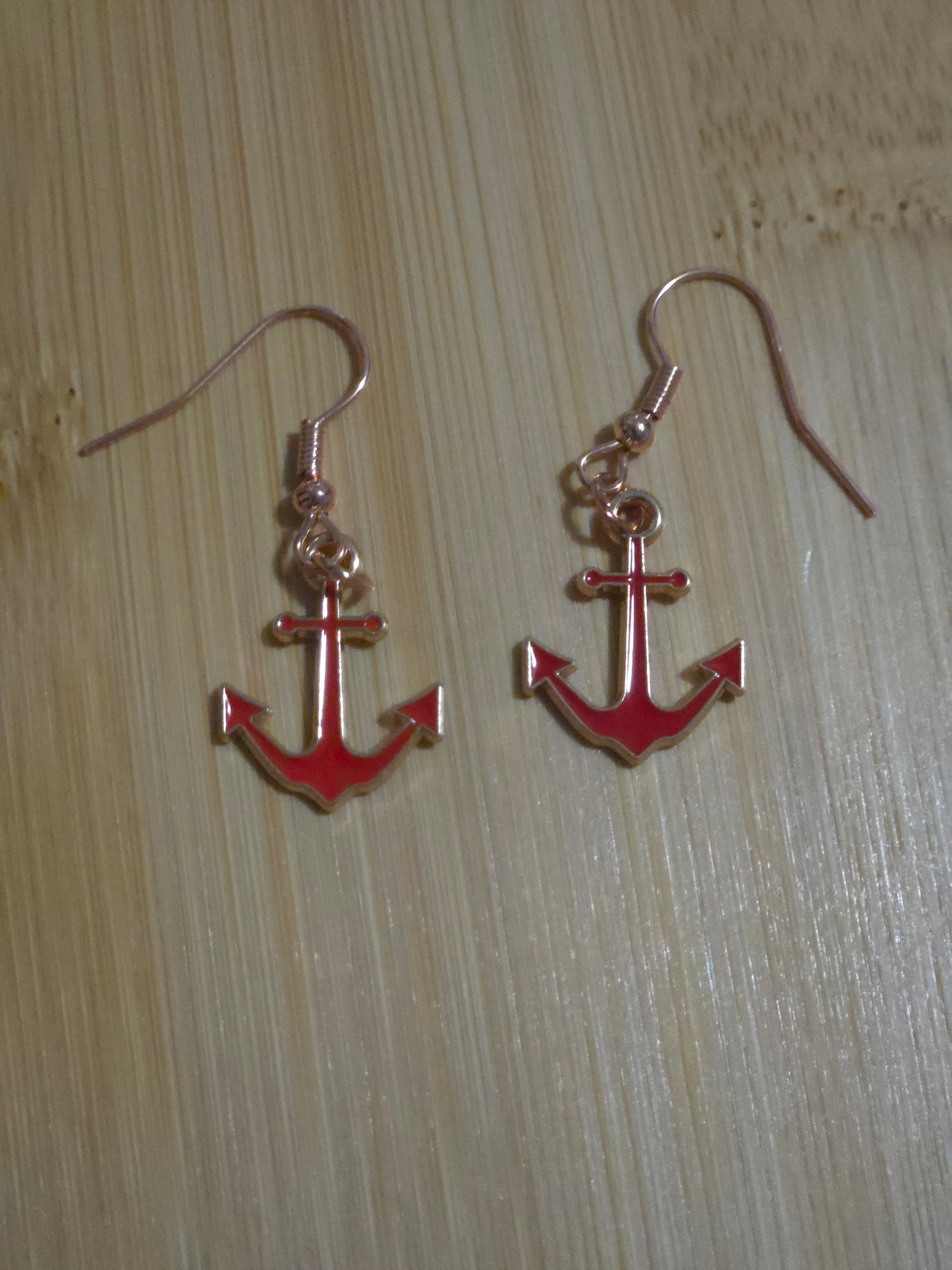 Red dangle anchor earrings